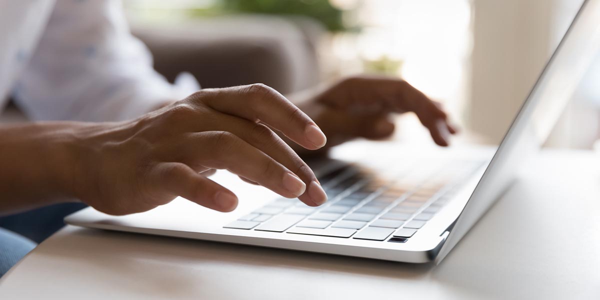 Person typing on computer